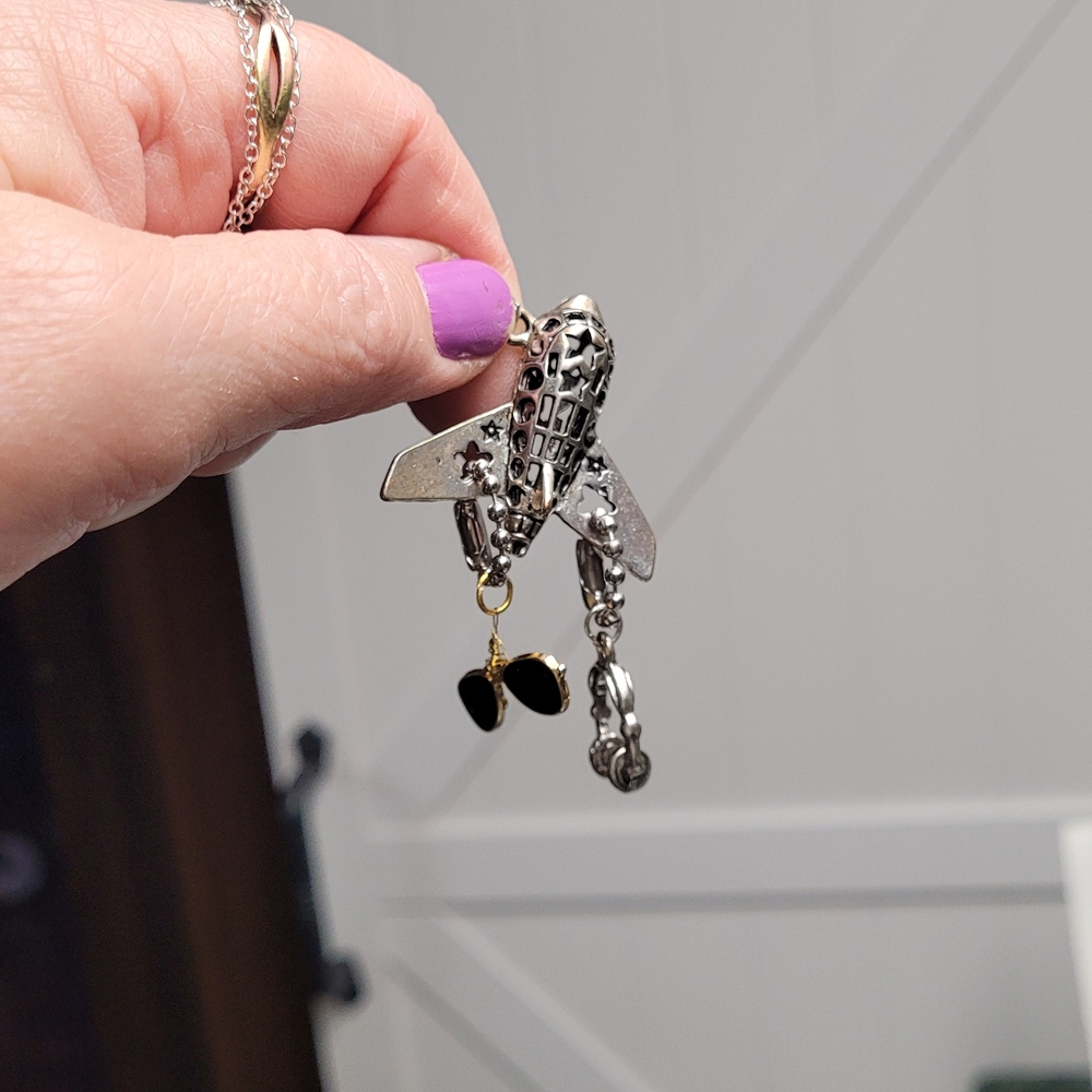 Hand Crafted Silver and Black Airplane Necklace with Charm Accents
